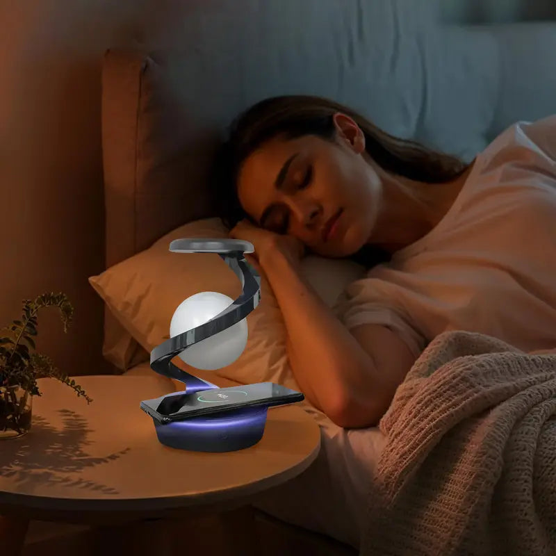 Woman sleeping in bed with a night light on a bedside table.